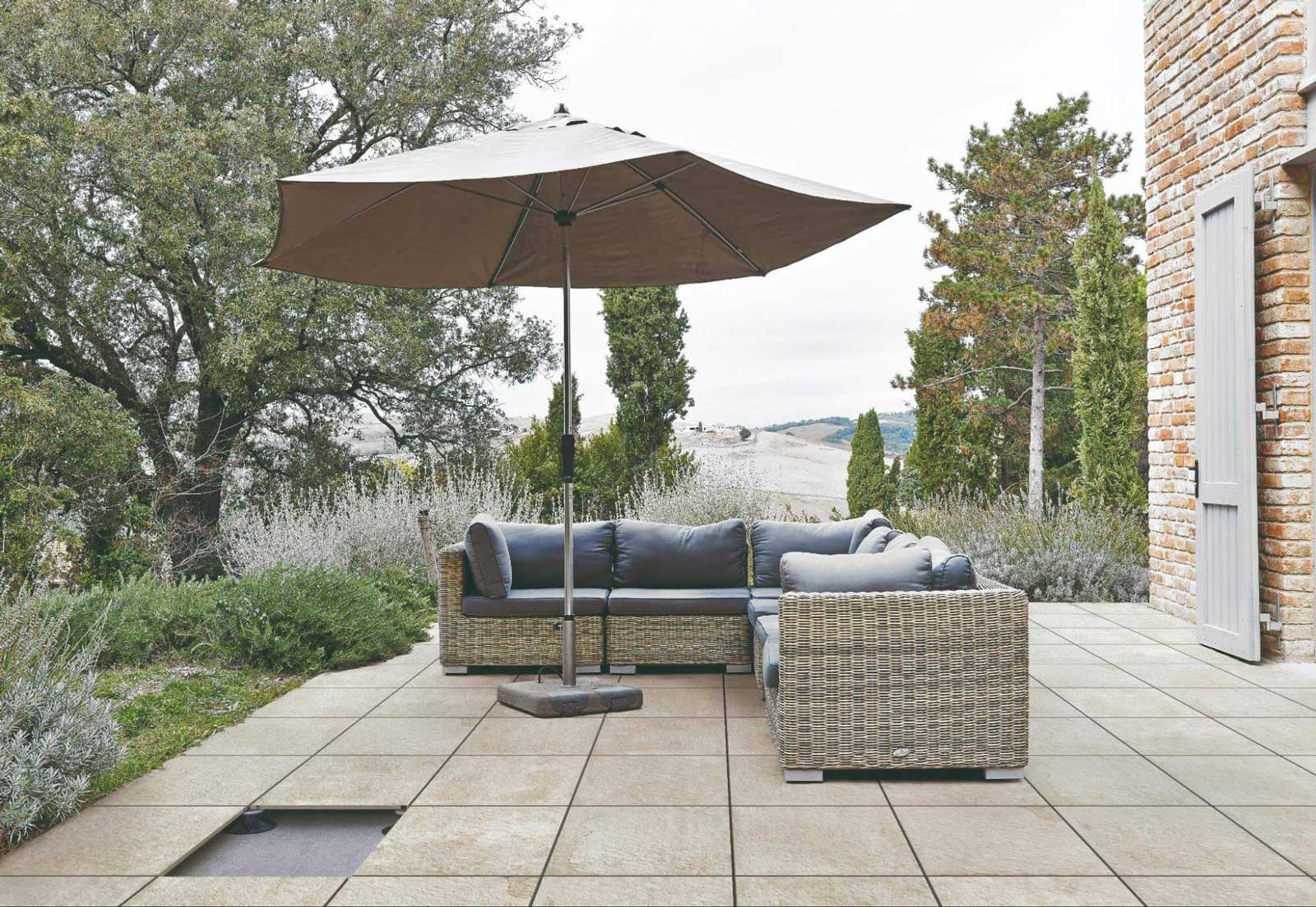 Outdoor tile deck with patio furniture.