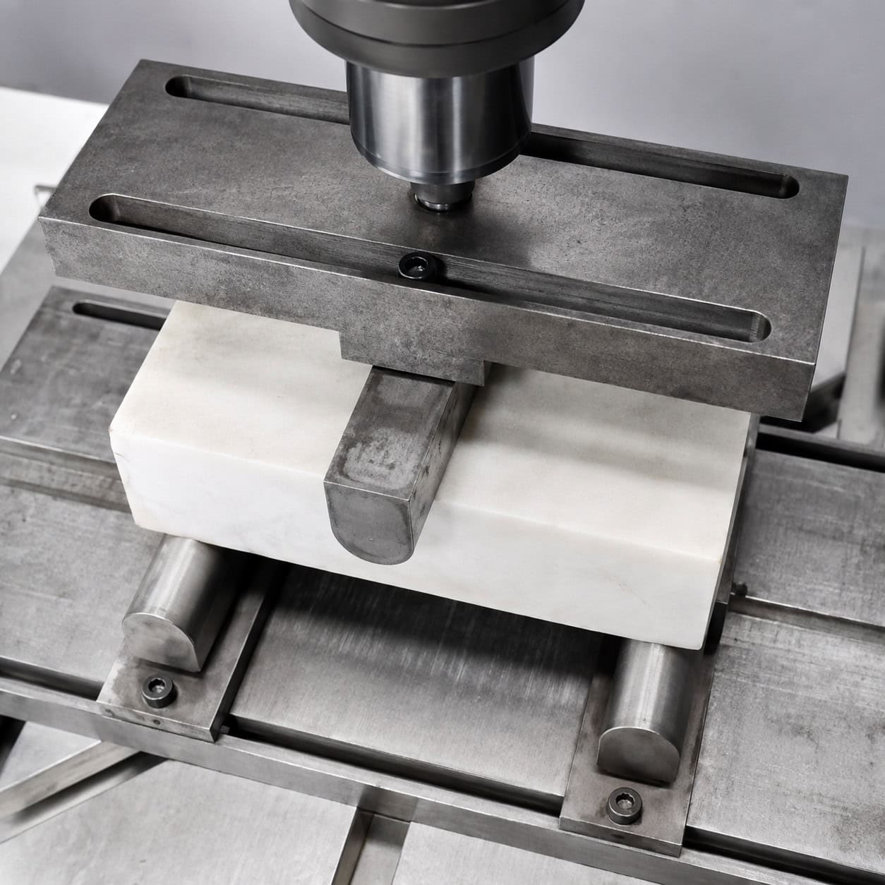 Dimension stone sample undergoing flexural strength testing